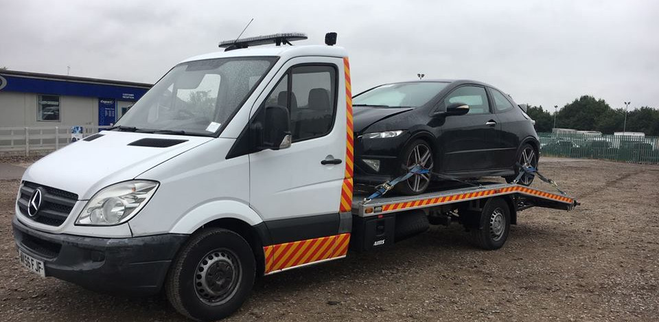 Car recovery in Kent – flatbed truck loading a car in Birchington